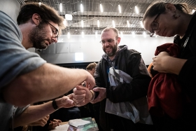 Volunteers handing out wristbands before the screening / Photo: Zoltán Adrián